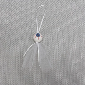 Creepy DIY eyeball hanging ornament with blue iris, red veins and white tulle skirt