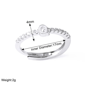 Macro detail of silver adjustable letter Q ring with 4mm band width and 17mm diameter