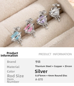 Detail of silver heart-shaped zircon cartilage earrings with titanium steel screw back