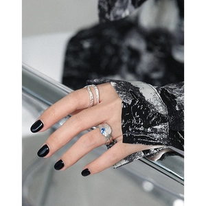 Irregular textured S925 sterling silver ring set with vibrant blue zircon stone accent