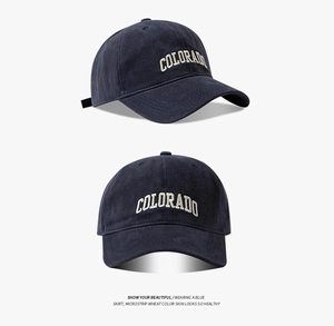 Detail of navy blue cotton baseball cap with white Colorado embroidery and 6-panel crown
