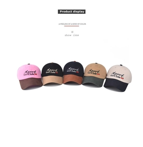 Detail showing five colors of washed cotton baseball caps with cherry embroidery detail