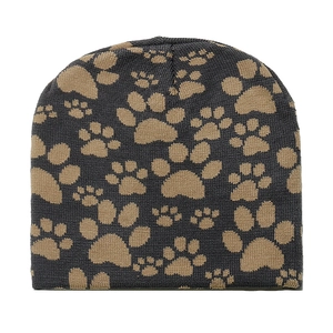 Detailed close-up of knitted winter beanie featuring brown animal paw print jacquard patterns
