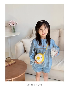 Girl's outfit set featuring a bright yellow donut-shaped crossbody bag and a beret