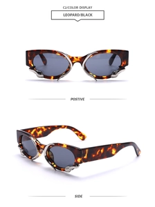 Detail of leopard print sunglasses with silver snake accents and grey lenses
