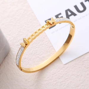 Elegant gold-plated stainless steel bangle featuring double butterflies and pavé crystals