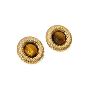 Detail of gold hammered earrings featuring round tiger eye stones on a white background