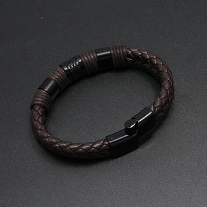 Detail of coffee brown braided leather bracelet with black magnetic alloy clasp for men