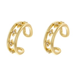 Detail of gold double-layer ear cuffs with star elements and cubic zirconia stones