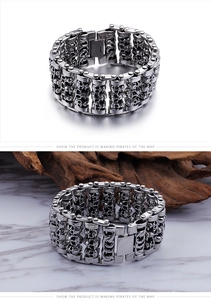 Detailed macro view of vintage silver punk skull bracelet with triple-row gothic relief