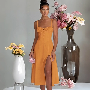 Detail of orange side slit dress showing the premium fabric texture and stylish draping