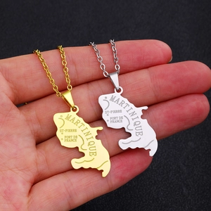 Detailed close-up of Martinique island map pendant necklace in polished gold and silver finish