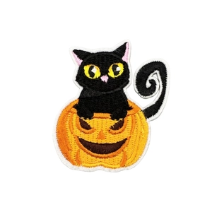 Halloween embroidery patch featuring a cute black cat sitting inside a carved pumpkin