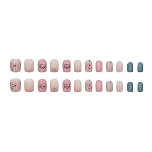 Sweet pink and blue press-on nails with heart patterns, smile face and Sweet lettering