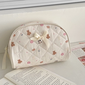 Quilted cream bear pattern makeup bag with ribbon bow and large storage capacity