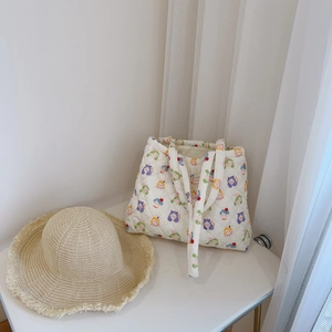 Quilted floral tote bag with cute cartoon patterns and straw sun hat for summer