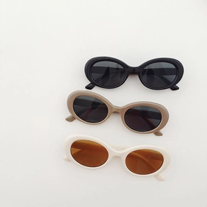 Kids vintage oval sunglasses in black, brown, and cream with UV protection