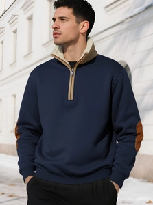 Close-up of navy quarter-zip sweatshirt with fleece collar and brown elbow patches