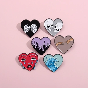 Set of six heart-shaped enamel pins featuring skull, flame, and wave designs on pink background