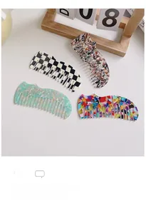Detail view of four acetate hair combs featuring marble and checkerboard patterns