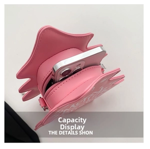 Capacité intérieure du sac bandoulière rose en forme d'étoile avec smartphone