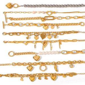 Gold OT buckle stainless steel bracelets with heart charms and white pearls collection