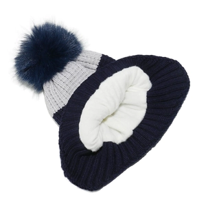 Detail of winter knit hat featuring navy and grey stripes with thick white fleece lining