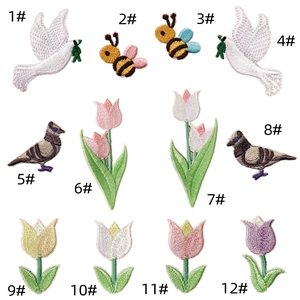 Grid layout showing twelve colorful embroidered patches including birds, bees, and flowers