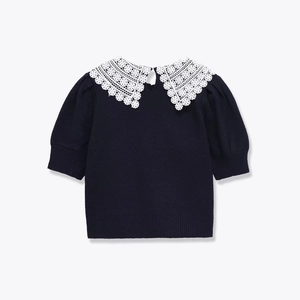Navy knit short sleeve top with white crochet lace lapel collar and puff sleeves