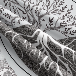 Macro shot of tree pattern print on fabric highlighting woven texture and soft folds