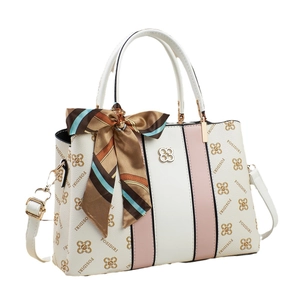 Chic pink and white handbag with monogram pattern and decorative silk scarf