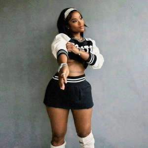 Detail of black and white baseball crop hoodie set with STA letter print and skirt