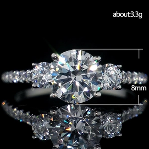 Three-stone round cubic zirconia ring with 8mm main stone and 3.3g silver-tone band