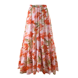 Detailed view of pink floral tiered maxi skirt with elastic waist and chiffon texture