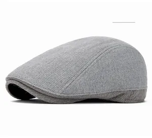 Detail of light gray flat cap fabric texture and black inner lining craftmanship
