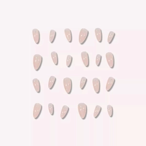 Short almond press-on nails in nude pink with subtle glitter stars for women