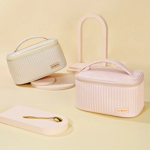 Elegant beige and pink PU leather cosmetic bags with quilted stripes and gold zippers