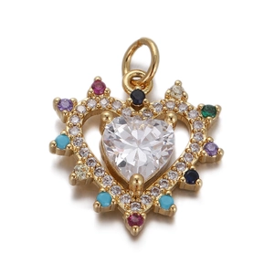 Detail of a golden heart pendant with a large clear center stone and colorful crystals