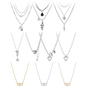 Set of 10 fashionable necklaces including heart charms, pearls, and multi-layer gold chains