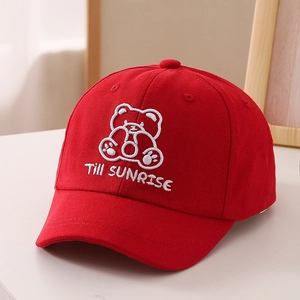 Detailed embroidery of cartoon bear and Till Sunrise text on a red cotton baseball cap