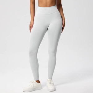 Close-up of light grey high-waisted seamless yoga pants with a wide tummy control waistband