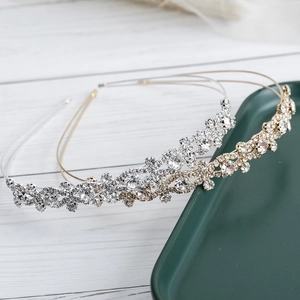Elegant rhinestone headband with sparkling crystals on gold and silver metal frames