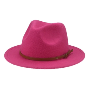 Detail of rose pink felt fedora hat for children featuring a brown leather decorative band