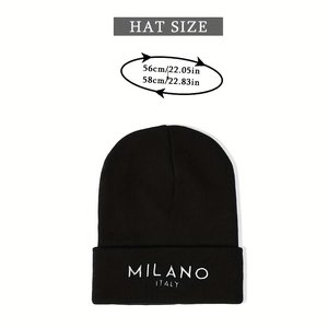 Detail of MILANO embroidery on black knit beanie with hat size guide info