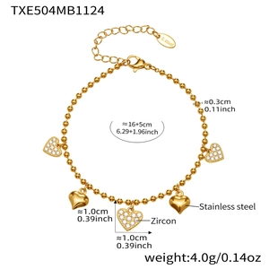 Detail view of gold stainless steel beaded bracelet with sparkling zircon heart charms