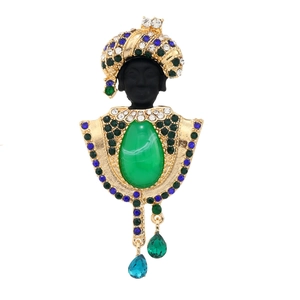 Exotic vintage black tribal chief brooch with green crystals and pearl tassels