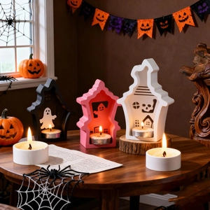 Dreiteilige Halloween-Geisterhaus-Kerzenhalter in Schwarz, Rosa und Weiß mit Teelichtern