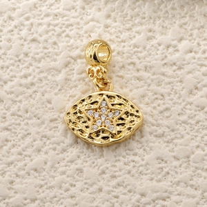 Detailed view of a gold star charm pendant with sparkling cubic zirconia and hammered texture
