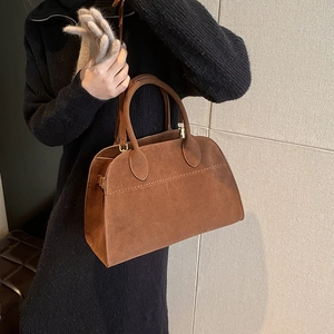 Brown suede tote bag for women showing a stylish shoulder carry style for autumn