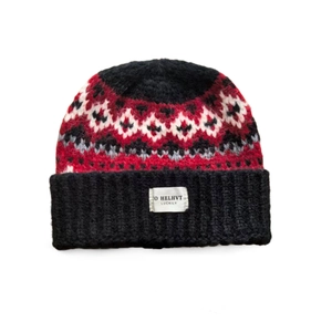 Detailed view of Fair Isle knit pattern and woven label on a winter beanie hat